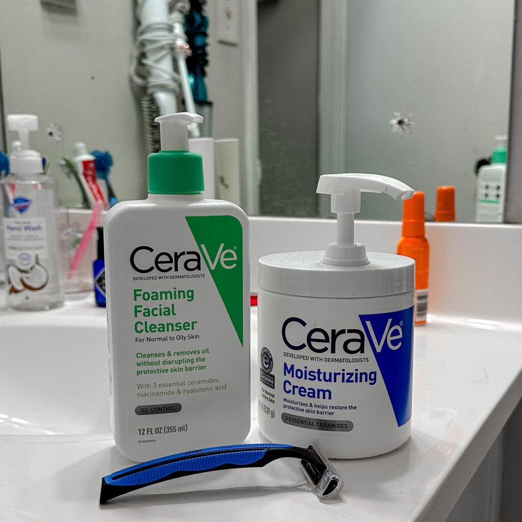 CeraVe face wash and moisturizer sitting on a white sink