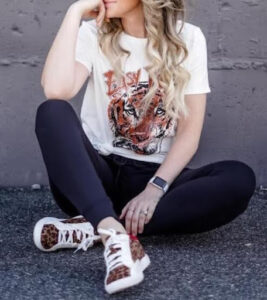 woman in tiger t-shirt and leopard prints sneakers